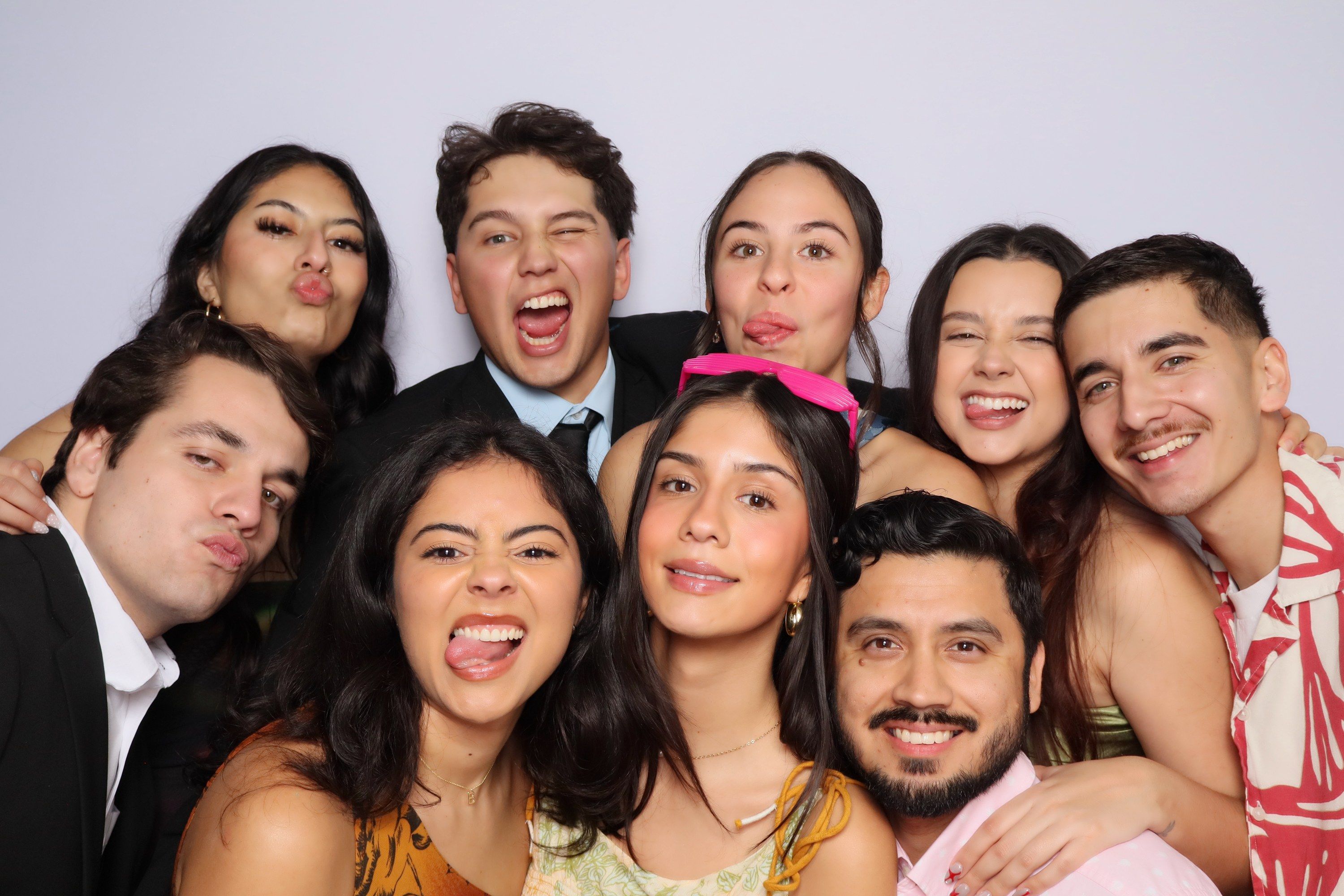 Guests posing together at a photo booth session
